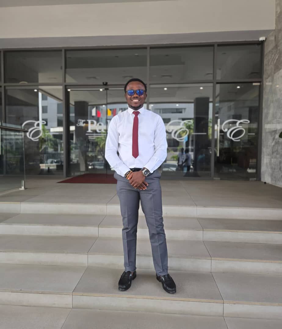 Awesome Emmanuel at the entrance of The Palms & Eagles, Accra