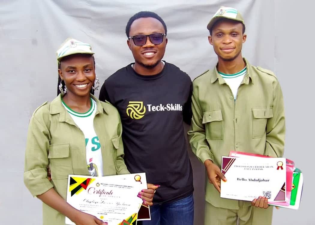 Awesome Emmanuel with NYSC corps members holding certificates